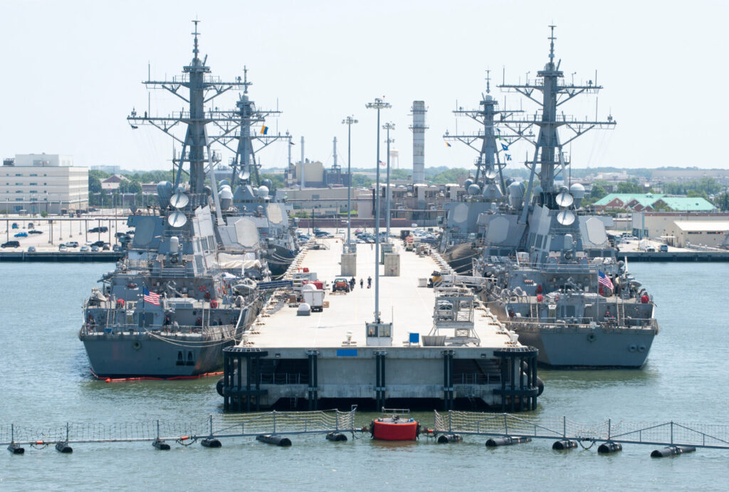 Four navy ships moored in a military base outside Norfolk town